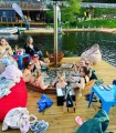 Relaxing with friends in the ciubar on the pontoon of a lake near Cluj